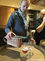 Jean Van Roy pouring a 1995 Saint Lamvinus