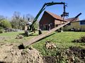 Installing hop poles at Het Boerenerf